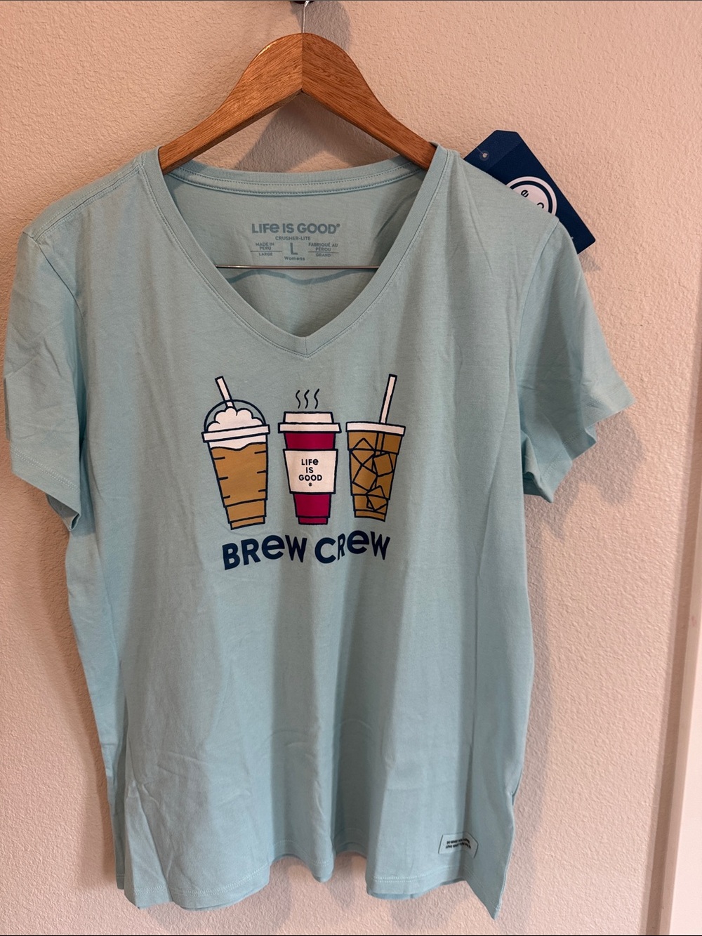 Life Is Good Pale Blue V‑Neck Tee with Coffee Trio Graphic
